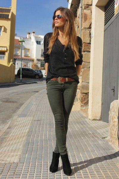 Black long sleeve t-shirt with green skinny trousers and ankle
boots