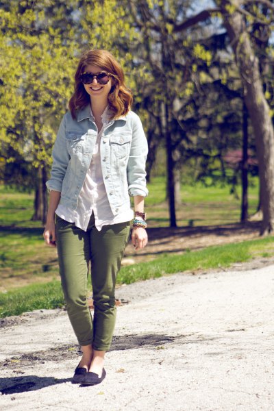 light blue denim jacket with white linen blouse and green slim-fit pants
