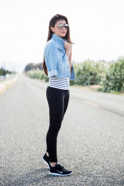 light blue short denim jacket with striped t-shirt and black and white hiking boots