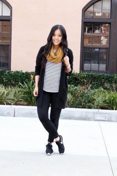 Black cardigan with striped t-shirt and hiking boots
