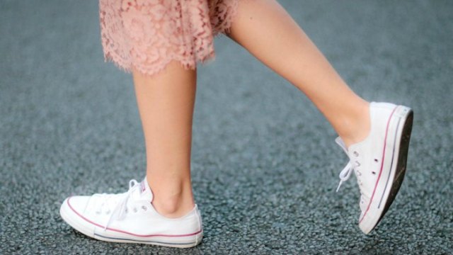 Pink lace midi shift dress with white low top walking
sneakers