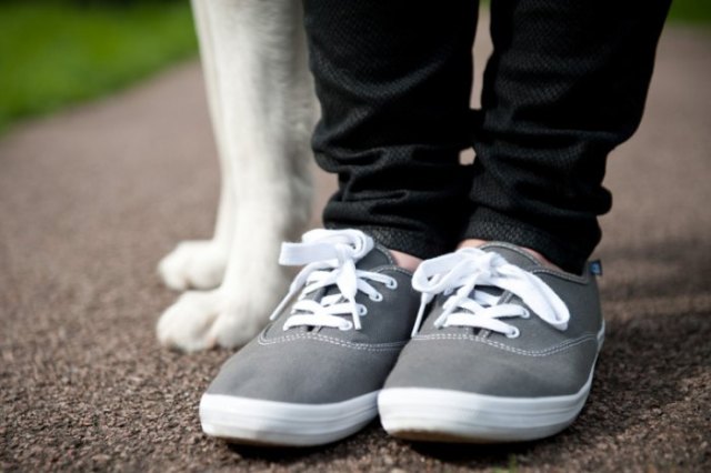 black slim-fit jeans with gray and white walking sneakers