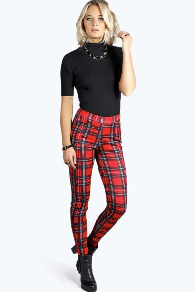 Black short sleeve fitted turtleneck with red high waisted plaid pants