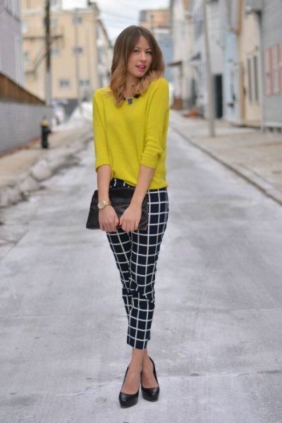 yellow sweater with black and white tight plaid pants