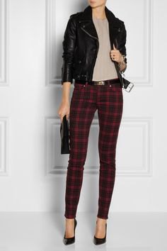 black motorcycle jacket with gray blouse and checked trousers