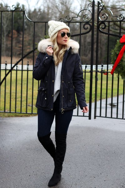 White knit coat with faux fur jacket and knee high boots