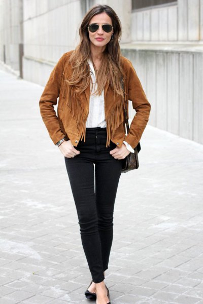 Brown suede fall jacket with fringes, white blouse and black jeans