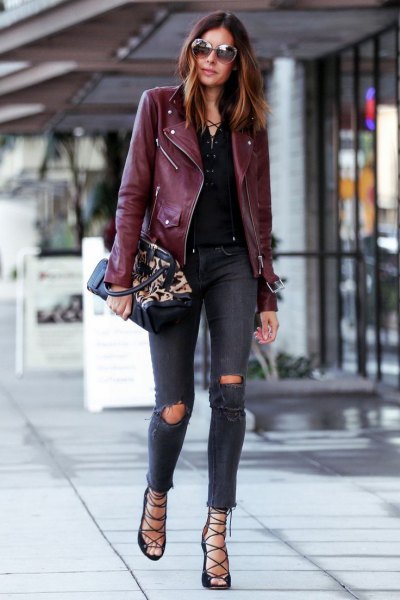 Pair a black leather jacket with navy skinny jeans with ripped knees