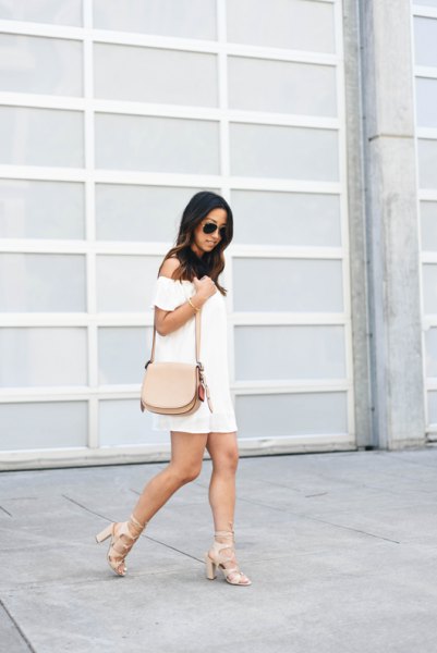 White strapless mini shift dress with pink strappy heels