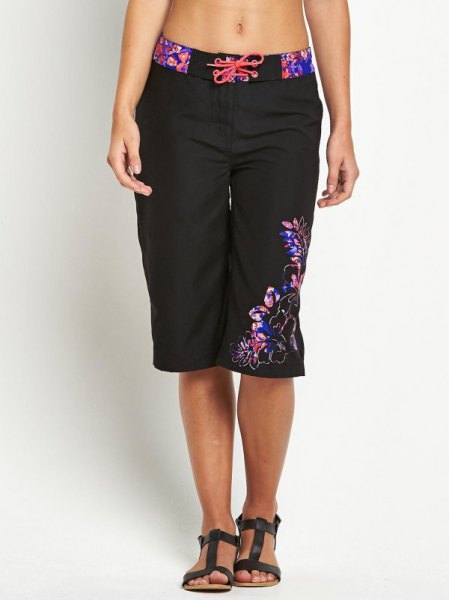 Black and blue floral embroidered knee length baggy shorts with a
crop top