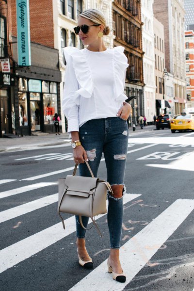 Pair a white ruffle shoulder blouse with ripped gray skinny
jeans