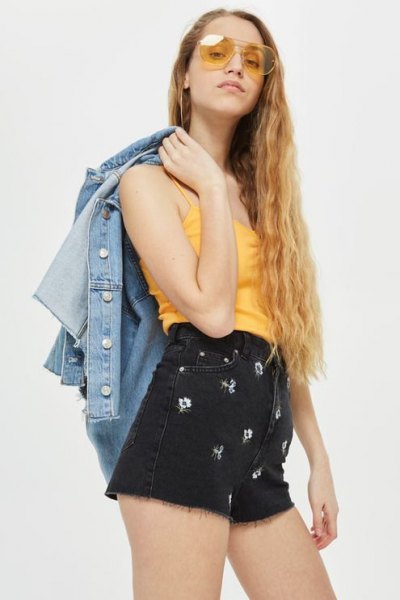 yellow tank top with black cute high waisted denim shorts and denim jacket