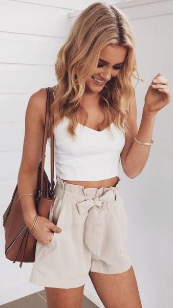 White V-neck cropped tank top and flowy high rise shorts with pale pink bow at front