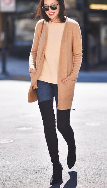 blush pink wool coat with ivory sweater and thigh high boots