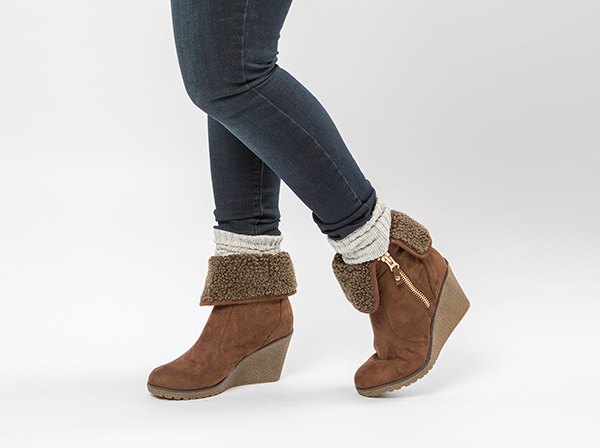 gray skinny jeans with white crew socks and camel fur boots with side zips