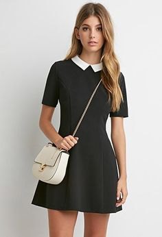 Black collared fit and flare mini dress with white leather shoulder bag