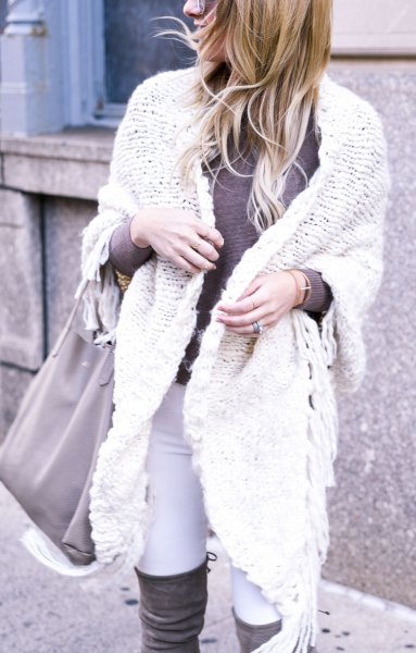 White cable knit wrap sweater and thigh high boots