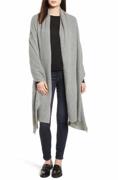 Gray longline knitted cardigan with a black sweater and slippers