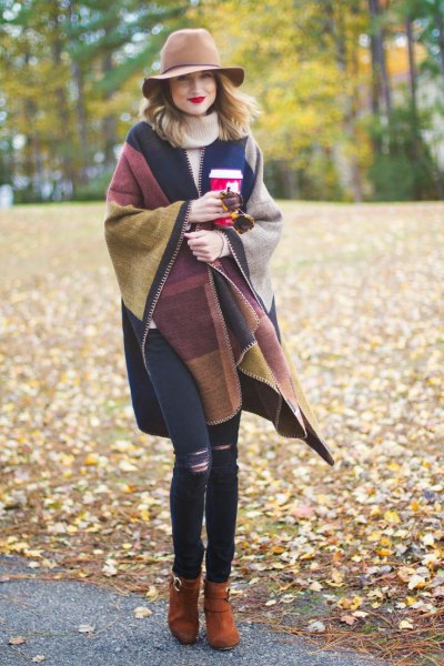 Brown and dark blue wrap sweater with floppy hat and skinny ripped jeans