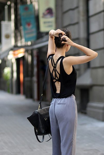 black tank top with gray loose-fitting cotton pants
