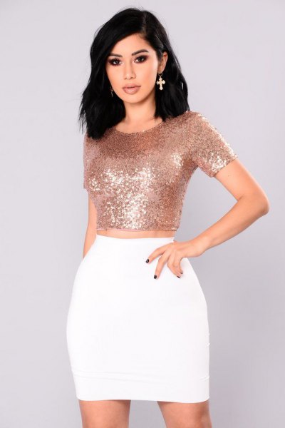 Rose gold bodycon crop top with white high rise mini skirt