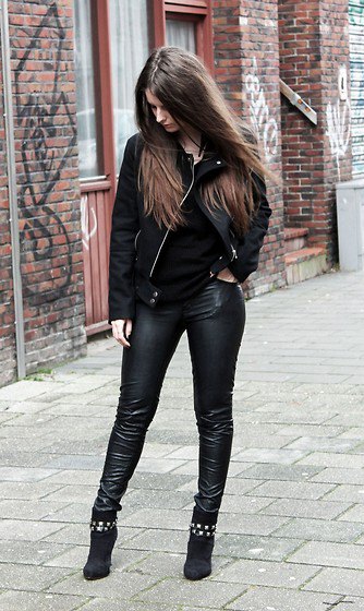 black denim jacket with leather leggings and suede boots with studs