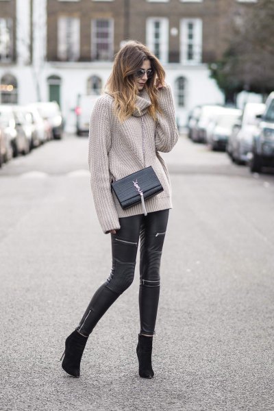 Gray ribbed cowl neck chunky sweater and black leather pants