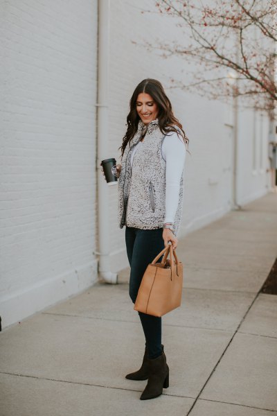 Gray sherpa vest with white long sleeve turtleneck tee