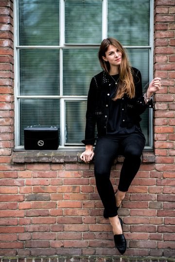 Black biker jacket with studs, skinny jeans and leather low shoes