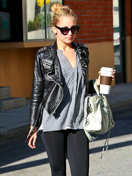 Black leather jacket with studs, gray V-neck t-shirt and leggings
