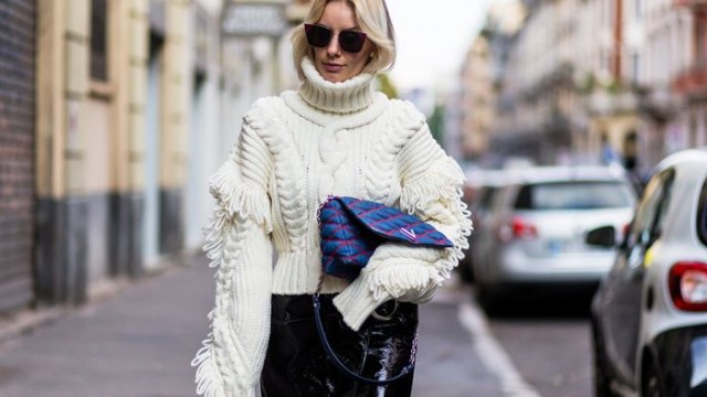 Pair with a white cable knit turtleneck and black leather pants to complement