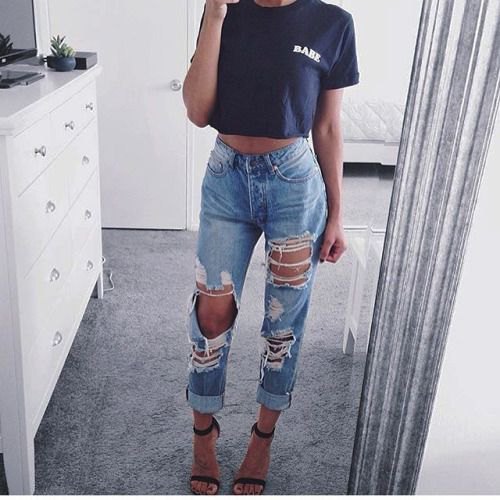 Black cropped graphic tee with ripped boyfriend jeans