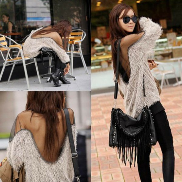 Fluffy two-tone sweater with an open back and black skinny jeans