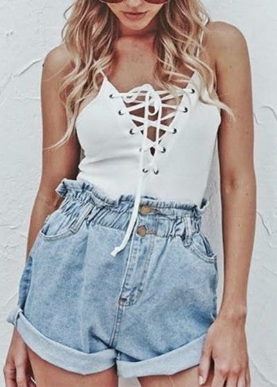 White spaghetti strap top with lacing and blue denim shorts with elastic waistband