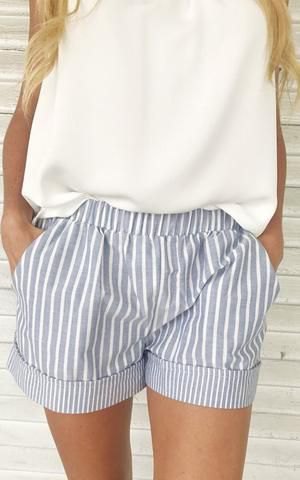 White relaxed fit sleeveless top and gray striped mini shorts with elastic waistband