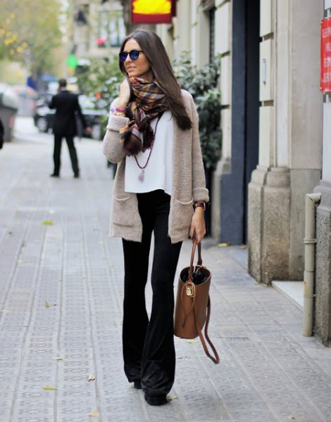 gray cardigan with white chiffon blouse and black flared jeans