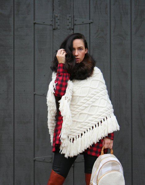 White cable knit scarf and red and black checked tunic shirt