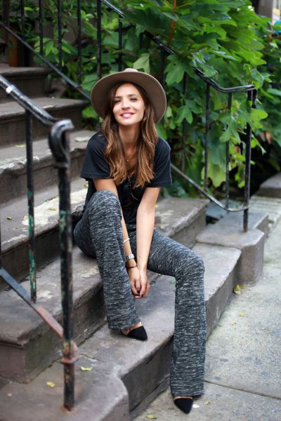 Black t-shirt with gray flared knit trousers and heels