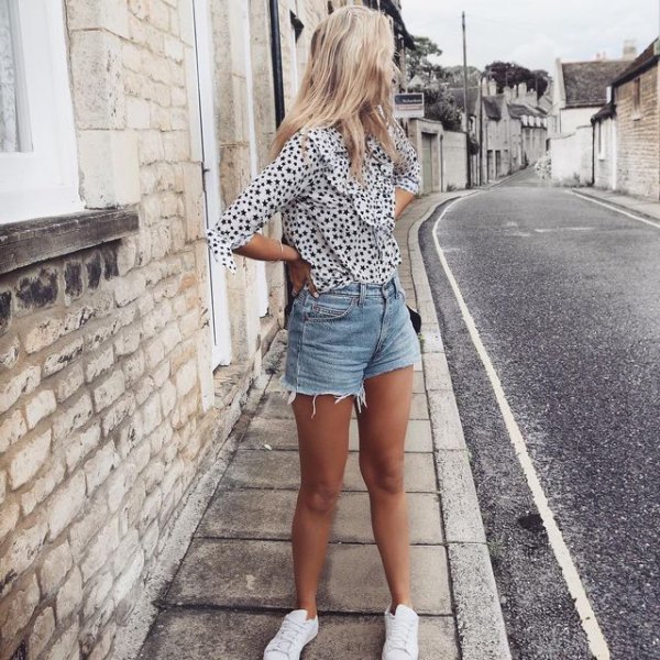 White and black polka dot chiffon blouse with distressed blue high waisted shorts