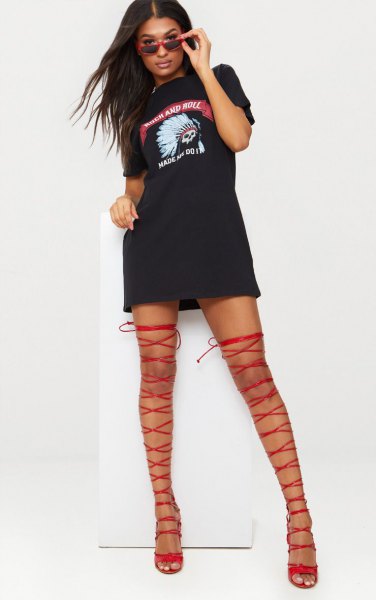 Black graphic tee dress with red thigh high gladiator heels