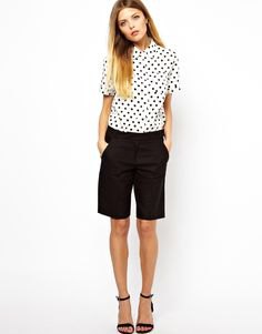 White and black polka dot button down shirt and long suit shorts