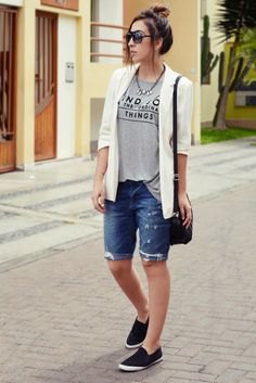 Casual white blazer with gray graphic tee and denim shorts