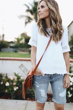 white lace top with ripped gray denim long shorts