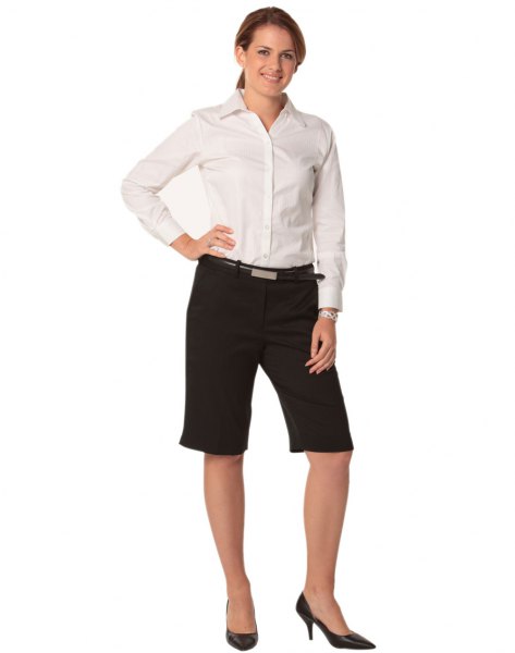 White button down shirt, black shorts and high heels