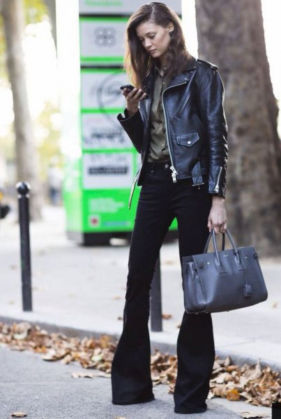 Black leather biker jacket with burgundy button down shirt and flared jeans