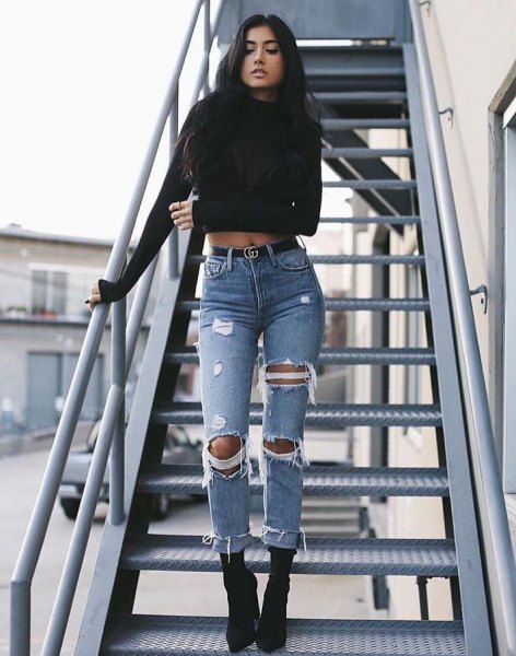 Black crew neck cropped sweater and ripped jeans