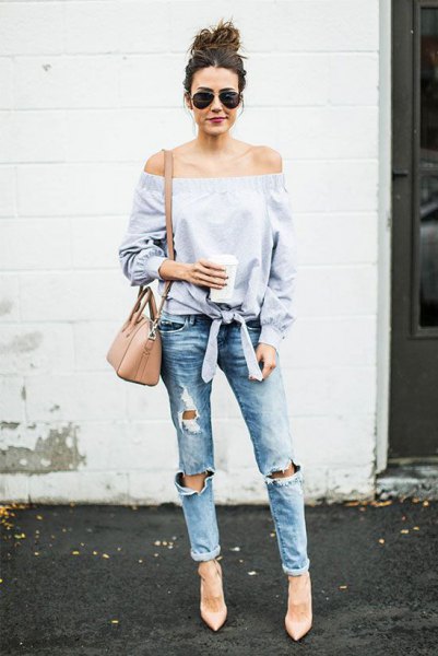 Light blue off the shoulder blouse with badly ripped jeans