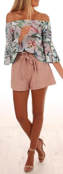 Pink and white floral strapless shirt paired with flowy mini shorts