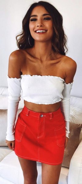 white long sleeve strapless cropped blouse with orange mini skirt
