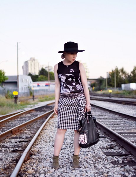 Graphic tank top with felt hat and checked knee-length skirt